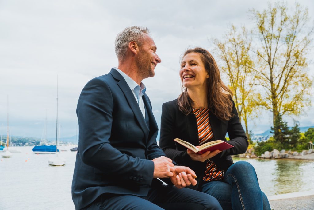 Two people reading and talking